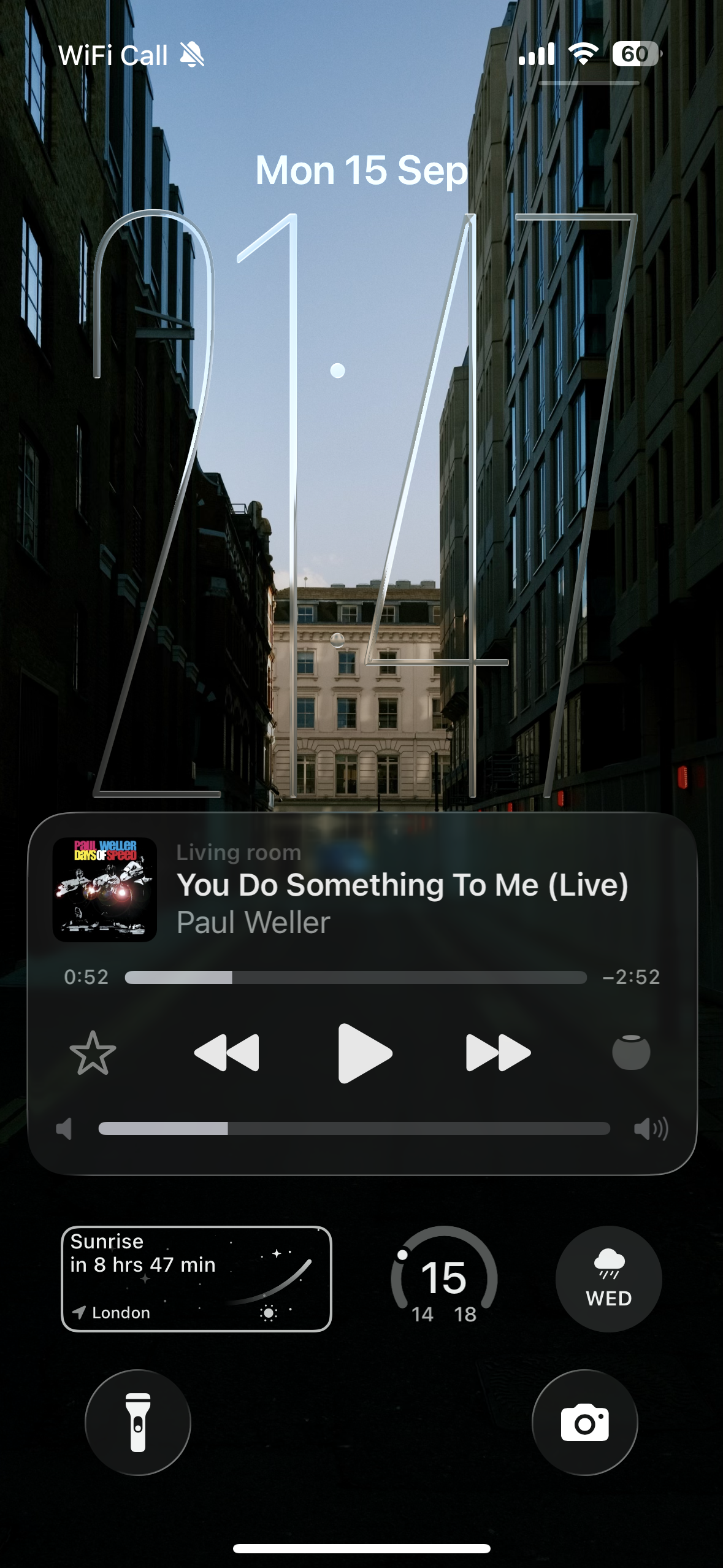 Screenshot of ios26 where there's a long clock on the Home Screen